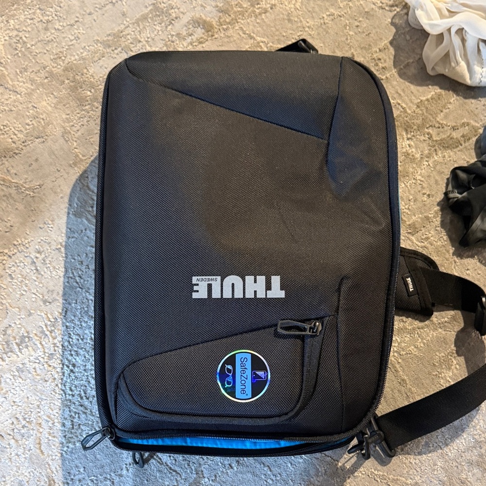 Thule Black Sling Bag with Blue Accent